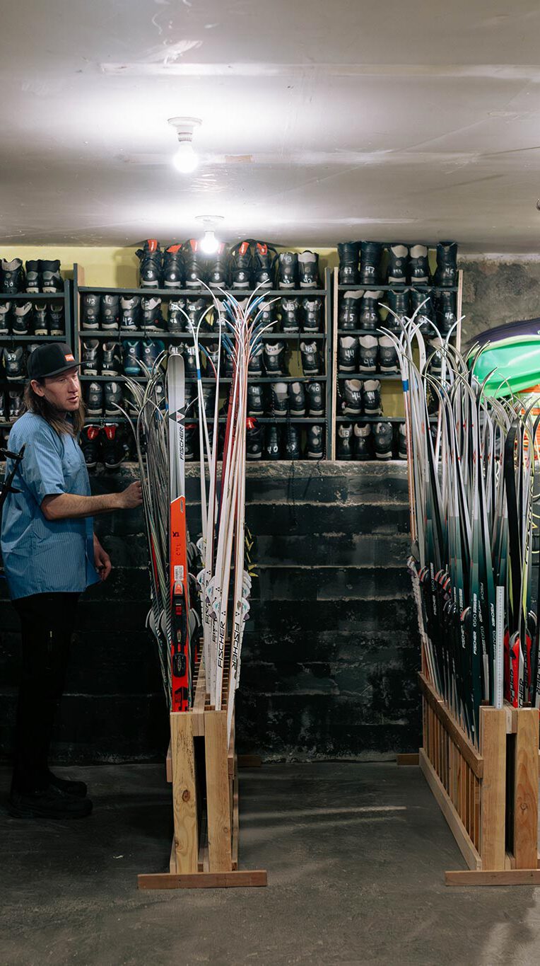 Equipment rental room with skis and ski boots