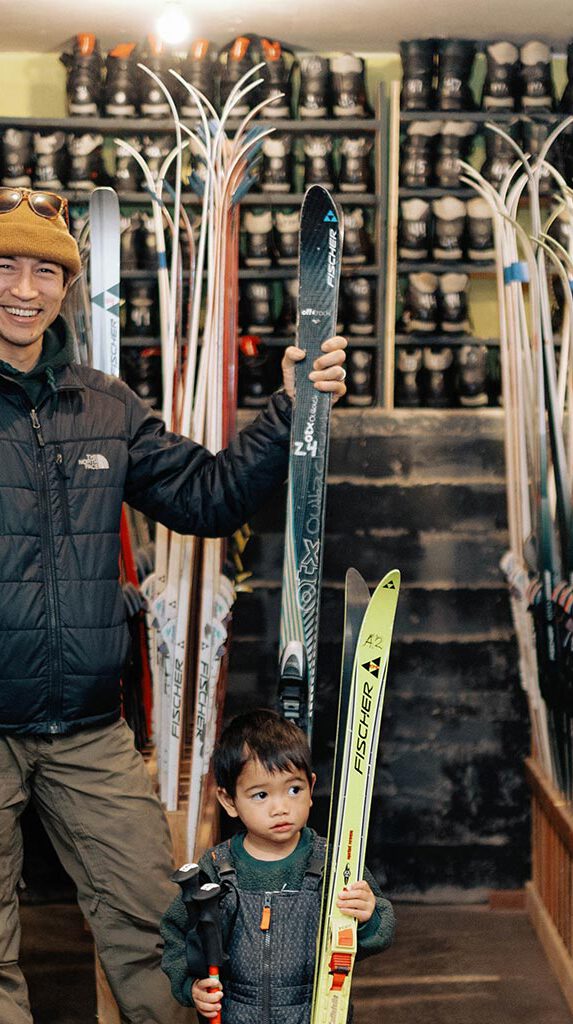 A family wearing skiing equipment