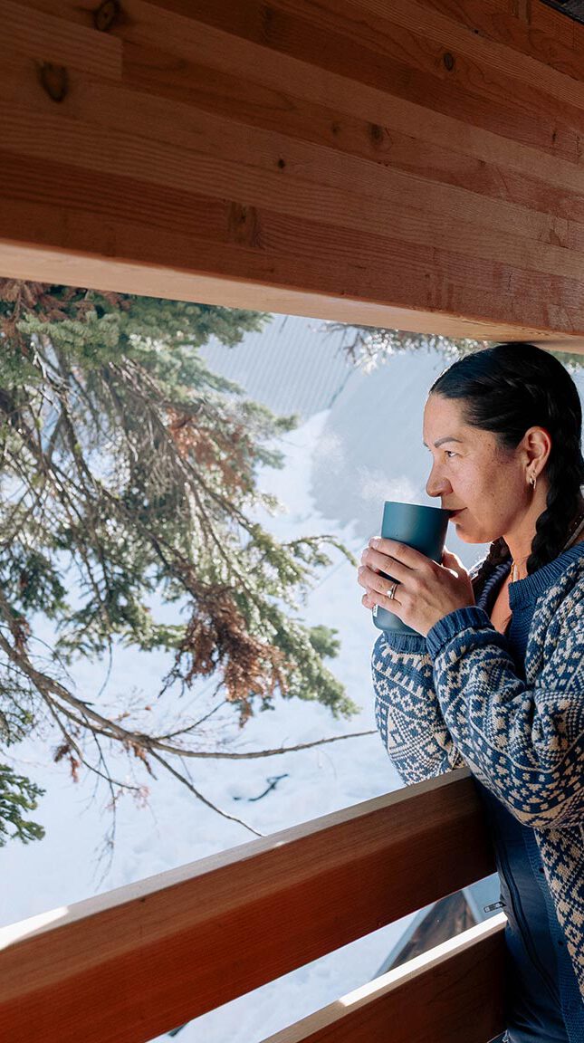 A woman drinking tea on the balcony