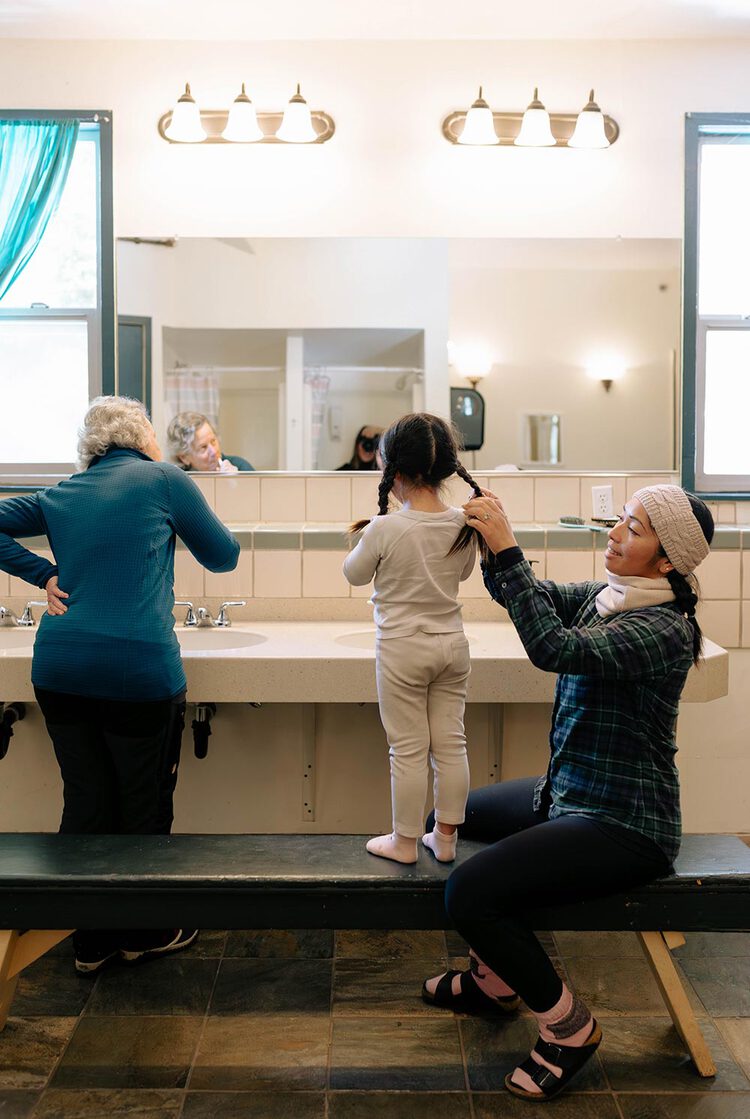 Women and a young girl in the bathroom